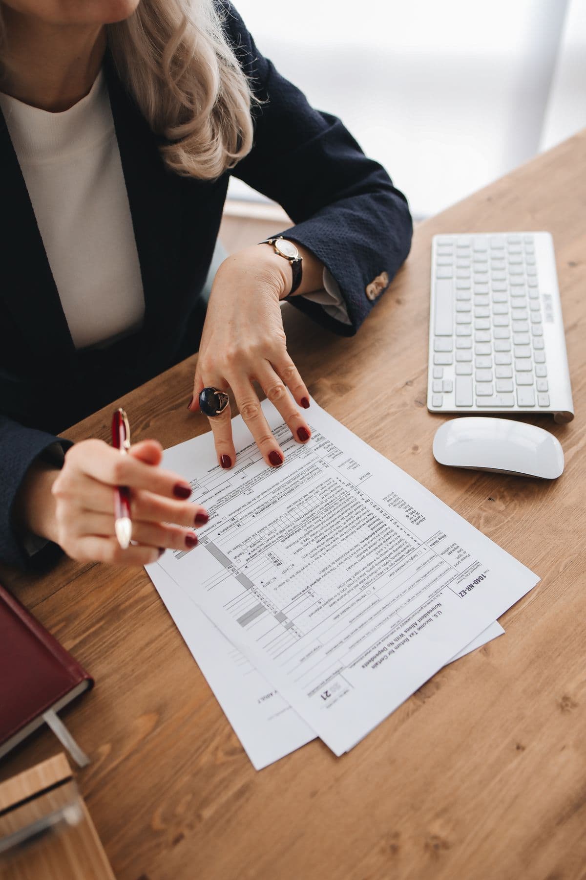 Tax forms and a calculator laid out for filing