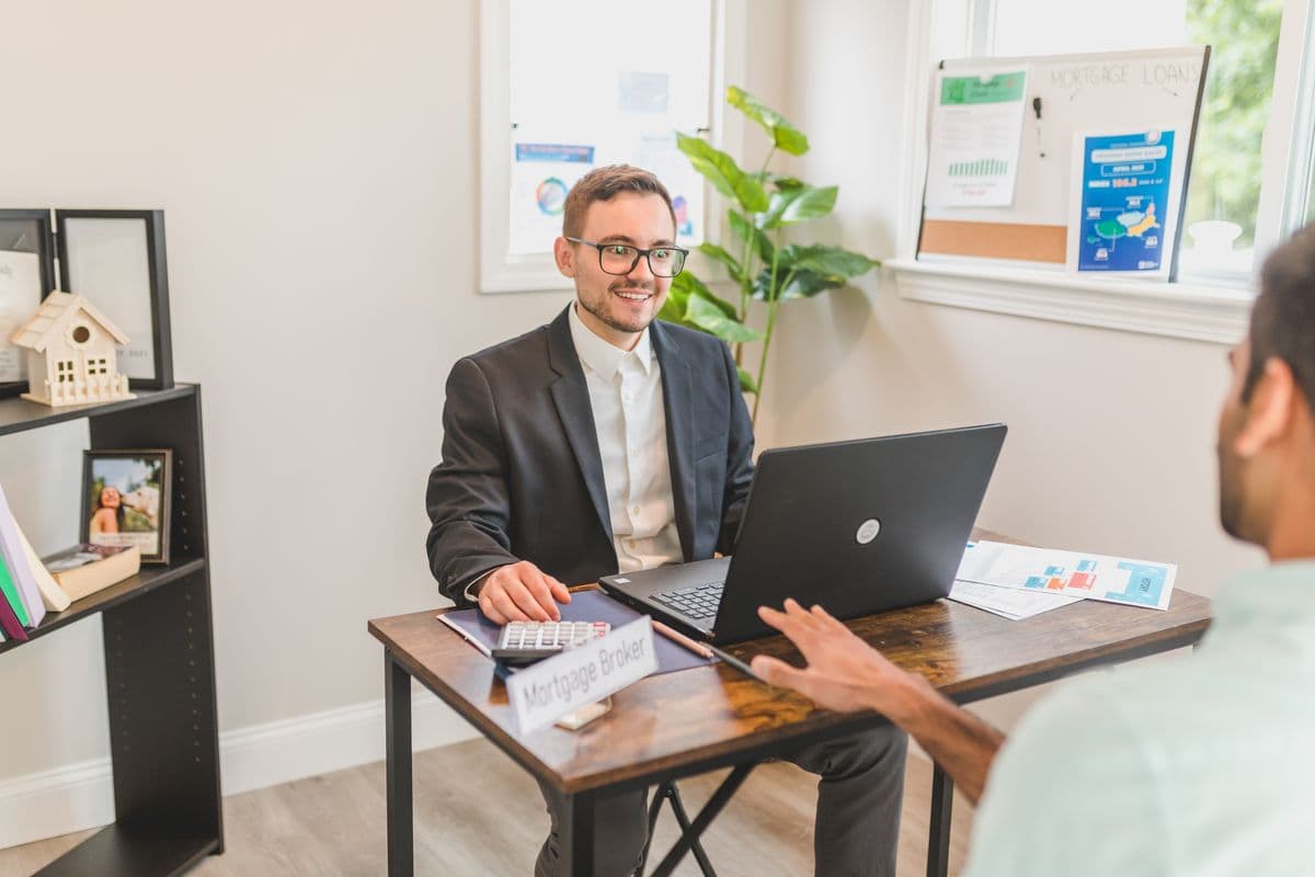 An accountant working in accounting software at a desk