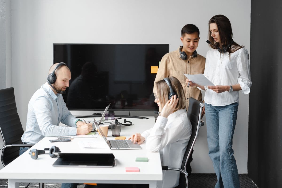 An operations team working together at a desk